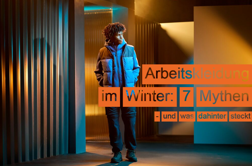 Ein Arbeiter in blauer und schwarzer Arbeitskleidung, der in einem Raum mit mehreren Durchg&auml;ngen steht. Die W&auml;nde sind gestreift und man sieht Licht und Schatten. Im rechten Bildbereich findet sich die &Uuml;berschrift: Arbeitskleidung im Winter: 7 Mythen - und was dahinter steckt